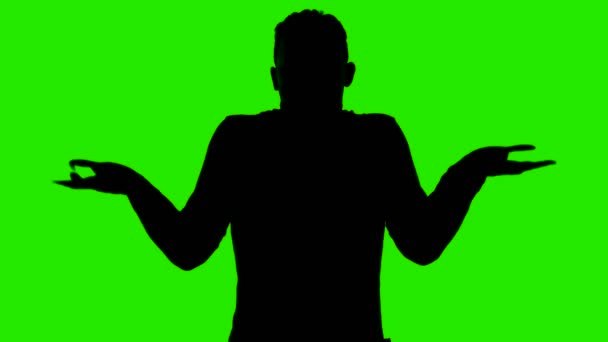 Video van de mens silhouet shrugging zijn handen op groene achtergrond — Stockvideo