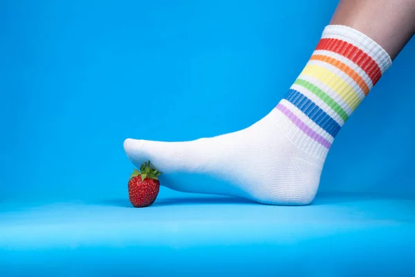 Concept image of squashed red strawberry, allegory — Stock Photo, Image