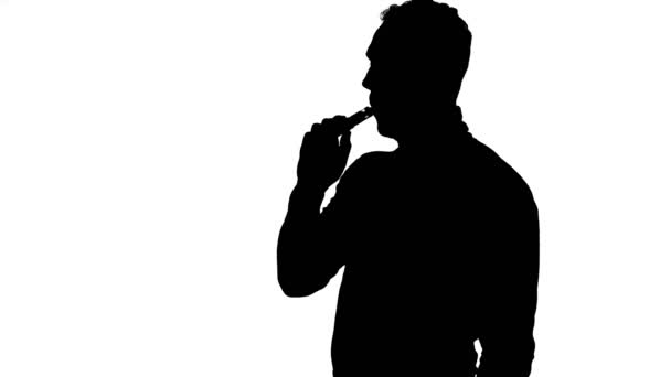 Video of coughing mans silhouette with vape — Stock Video