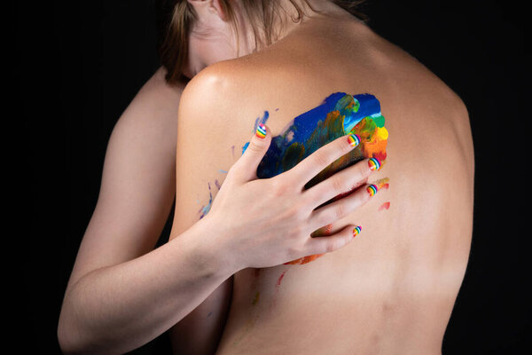 Picture of woman messing up rainbow on nude back