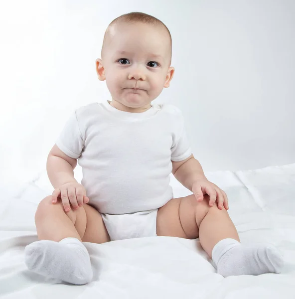 Photo of a pursing lips nine-month-old baby — Stock Photo, Image