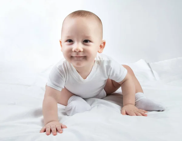 Photo of a nine-month-old child on a white background — Stock Photo, Image