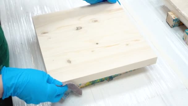 Video of woman with wooden board and sandpaper — Stock Video