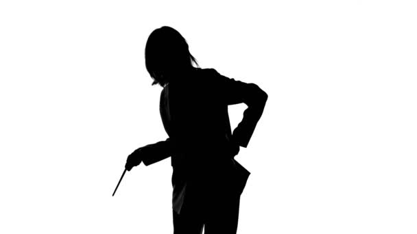 Shooting of pointing down womans silhouette in suit jacket — Stock Video