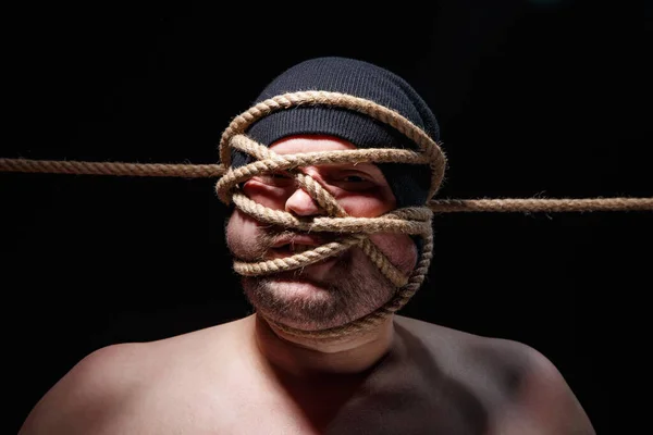 Image of binded fat man with rope on face — Stock Photo, Image