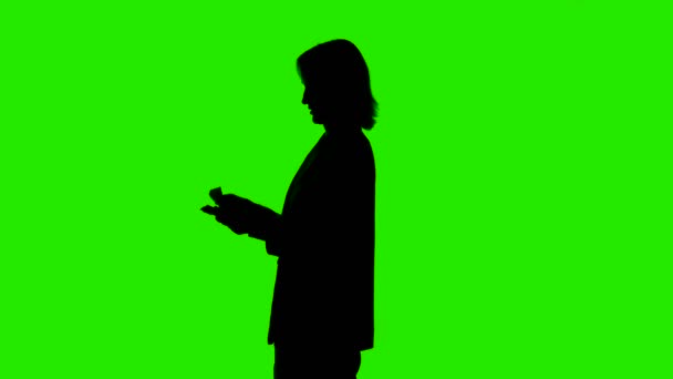 Counting money womans silhouette on green background — Stock Video