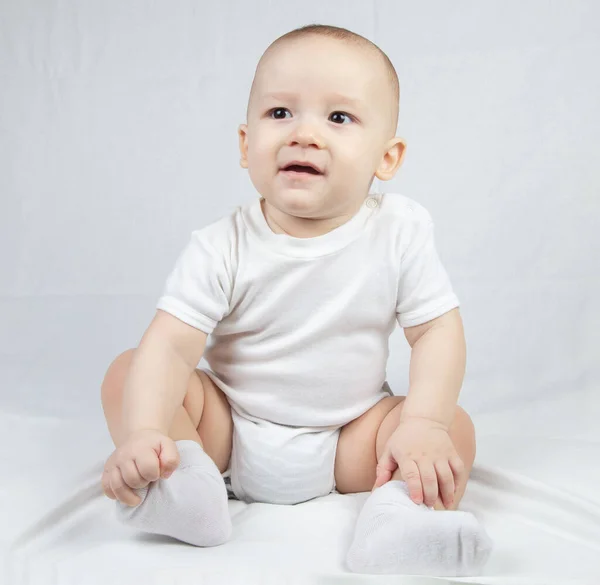 Photo of a brow neyes eight month old baby — Stock Photo, Image