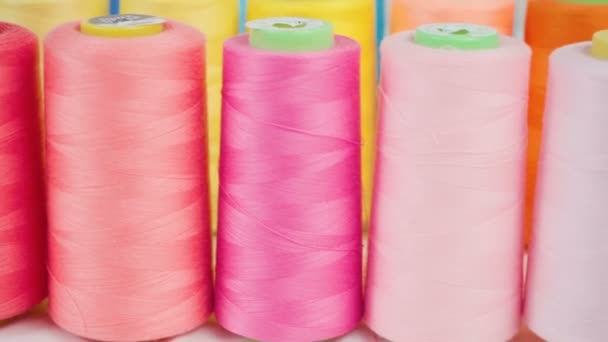 Footage of pink spools of threads in workshop — Stock Video