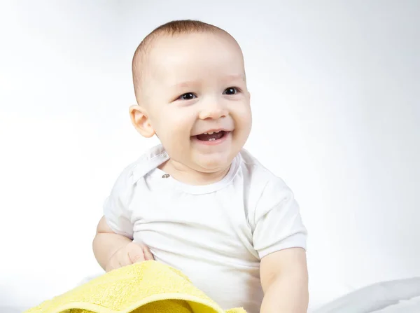 Photo of smiling eleven-month-old baby on a white background — Stock Photo, Image