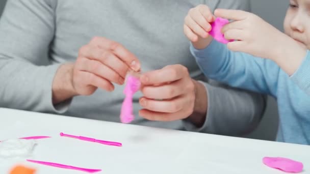 Video of dad and son sculpting in plasticine — Stock Video