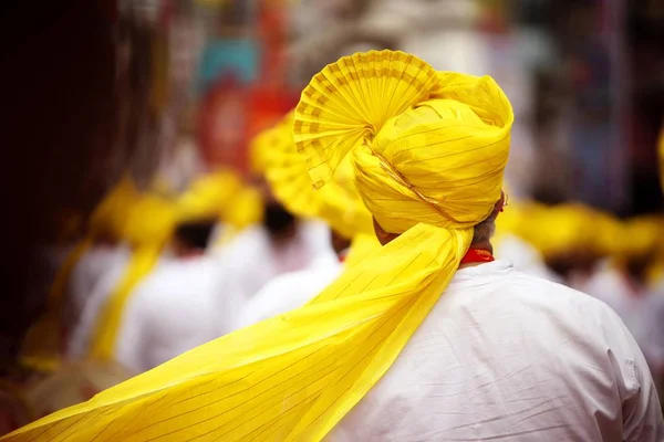 Men in yellow head wearable FETA in parade — Stock Photo, Image