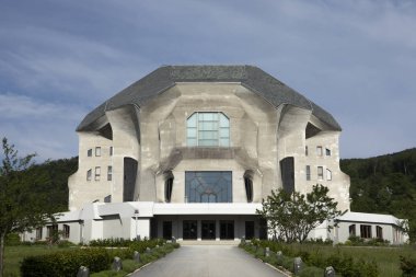 Dornach,  Kanton Solothurn/Switzerland - 05/22/2019: Goetheanum entrance. Rudolfa Steiner project. Front of the building with central path with blue sky. clipart