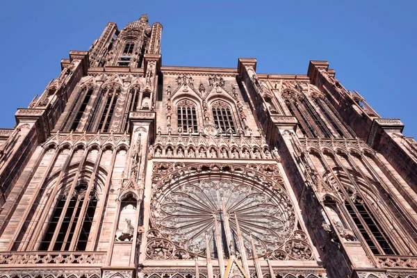 Bottom view of Notre Dame Cathedral in Strasbourg. Decorative facade with rose window. Strasbourg, France.