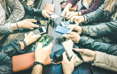 People hands having addicted fun together using smartphone - Millenial sharing content on social media network with mobile smart phones - Technology concept with millennials online on cellphone device clipart