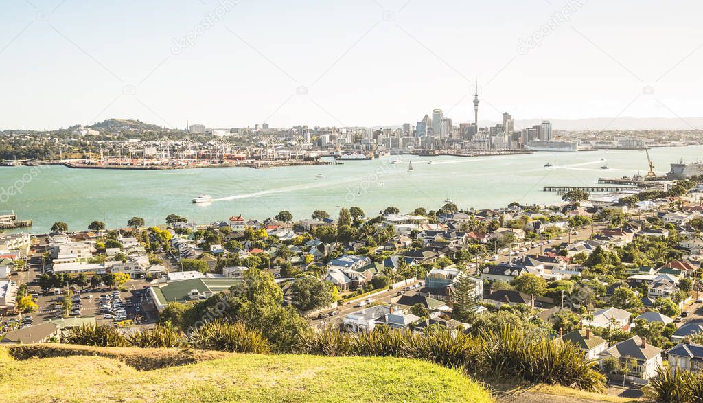 Breathtaking view of Auckland city skyline and bay gulf from Mount Victoria in Devonport area - High angle sight of the New Zealand world famous town - Bright greenish vintage filter