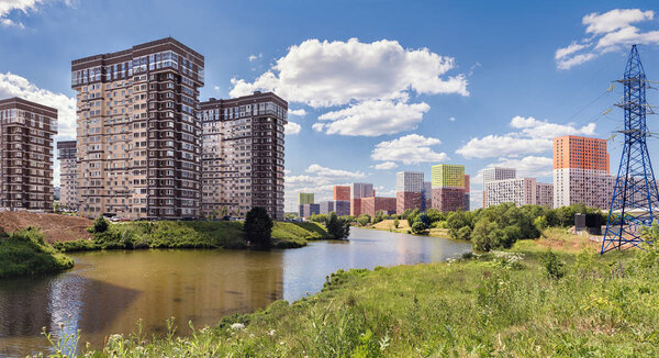 Moscow. June 19, 2019. Beautiful cityscape from the bank of the Setunka River. View of new residential complexes: Tatianin Park and Meshchersky Forest.