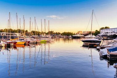 Moscow region, city Dolgoprudny, June 13, 2019. Yachts moored in the yacht club Neptune.  clipart