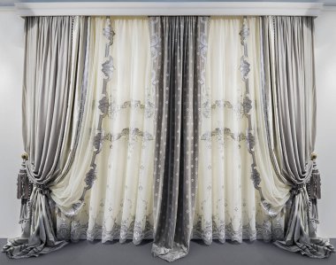 Modern interior design in the gray white colors. Straight velvet curtains and translucent tulle with embroidery clipart