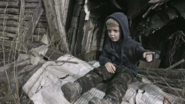 Sad Homeless Boy Sitting Abandoned Village — Stock Video