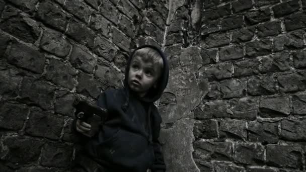 Homeless Dirty Boy Playing Gun Abandoned Building — Stock Video