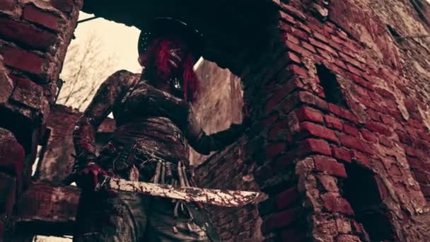 Zombie Headhunter Woman Machete Mask Posing Abandoned Building — Stock Video