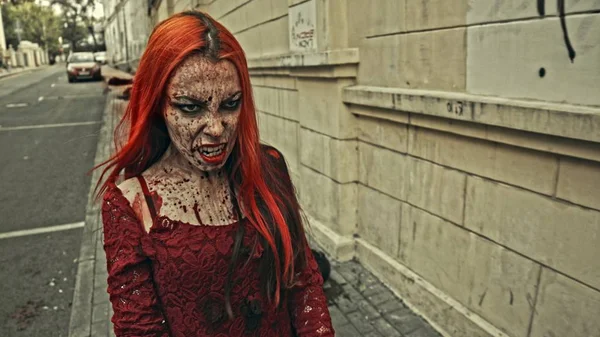 red head female vampire on urban street