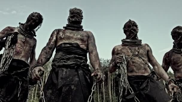 Dirty Male Slaves Chains Masks Standing Sand — Stock Video