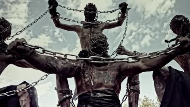 Dirty Male Slaves Chains Masks Standing Sand — Stock Video