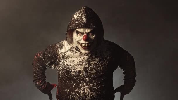 Scary Clown Man Hood Posing Misty Background — Stock Video