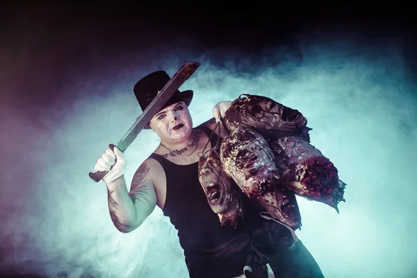 Portrait Zombie Killer Wearing Hat Machete Zombie Heads Posing Dark — Stock Photo, Image