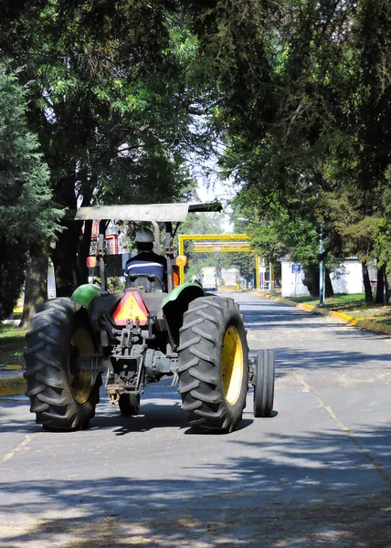 A tractor in an industrial park.