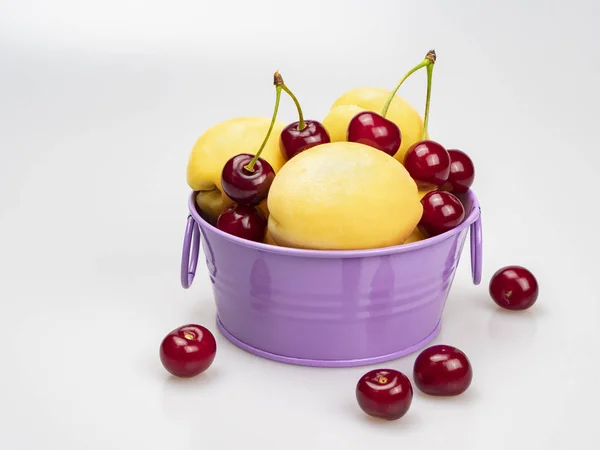 Yellow Apricots Ripe Cherries Lilac Bowl White Background Close Still — Stock Photo, Image