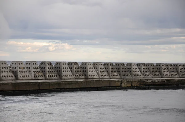 Concrete structures on the Black Sea in the form of pyramids - the breakwater.