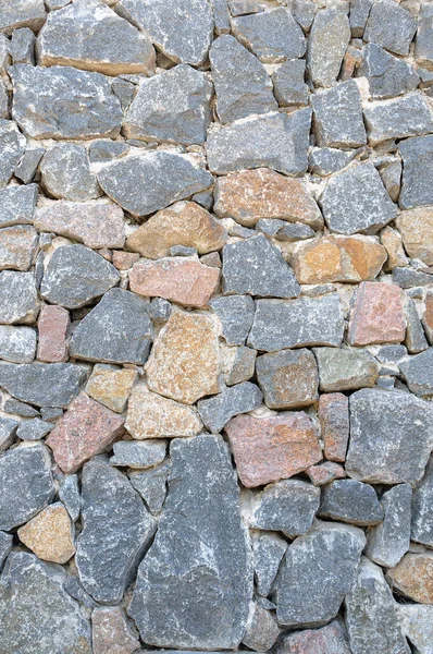 De textuur van de muur is gemaakt van natuursteen. — Stockfoto