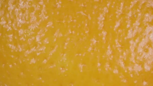 Oranžová kůra zblízka. Pomerančové ovoce. Makro video. Citrusové plody. — Stock video