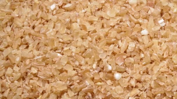 Wheat grit close-up. Solid wheat varieties. Wheat porridge. — Stock Video