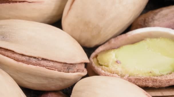 Pistachio close-up. Extreme macro. Lots of nuts. — Stock Video