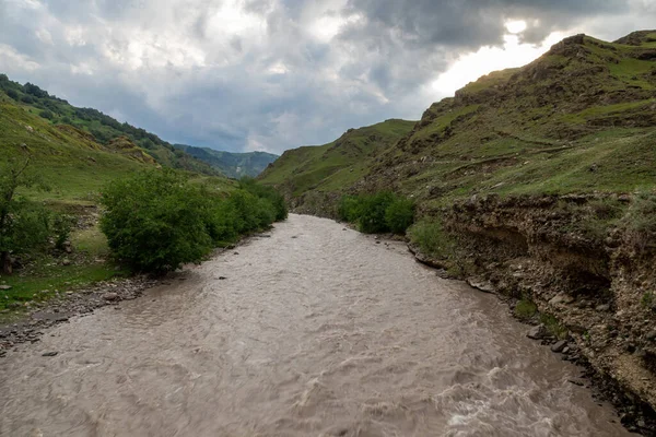 Mountain Landscape With A River. Panorama of a mountain river.