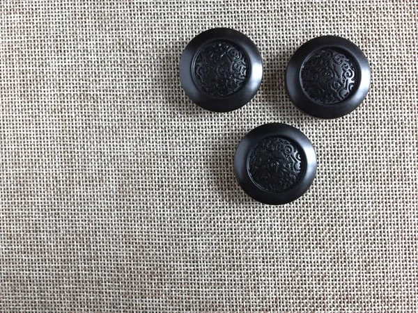Buttons for sewing on a light background.