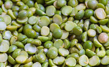 Photo of group of peas, close-up (peas split in half).