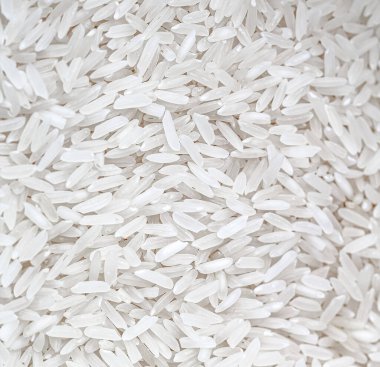 Raw white rice in close-up. (raw white rice in close-up photo).
