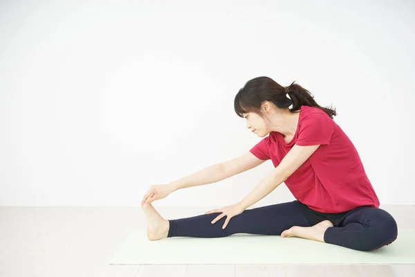 Young Woman Stretching Home — Stock Photo, Image