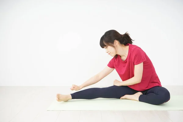 Young Woman Stretching Home — Stock Photo, Image