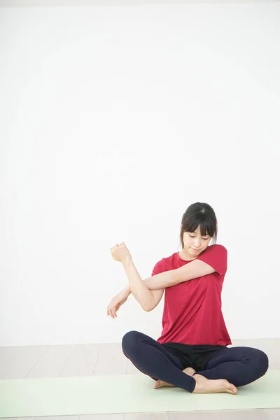 Young Woman Stretching Home — Stock Photo, Image