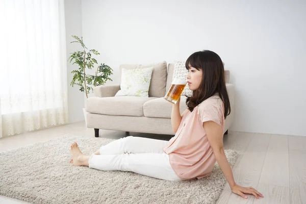 Young Woman Drinking Beer Home — Stock Photo, Image