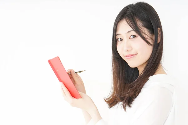 Mujer Joven Tomando Nota Cuaderno — Foto de Stock