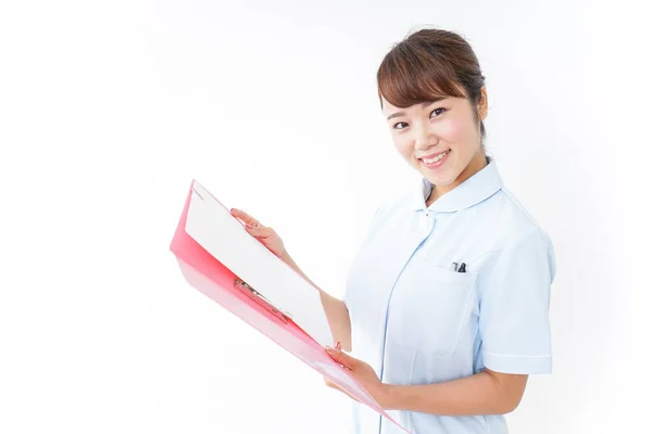 Young Asian Nurse Holding Folder — Stock Photo, Image