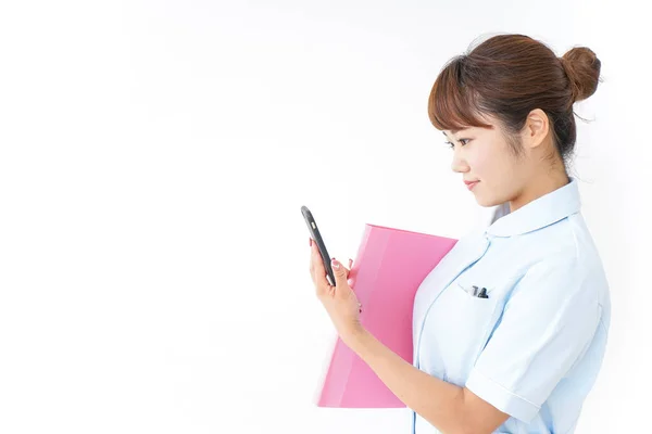 Young Nurse Folder Phone White Background — Stock Photo, Image