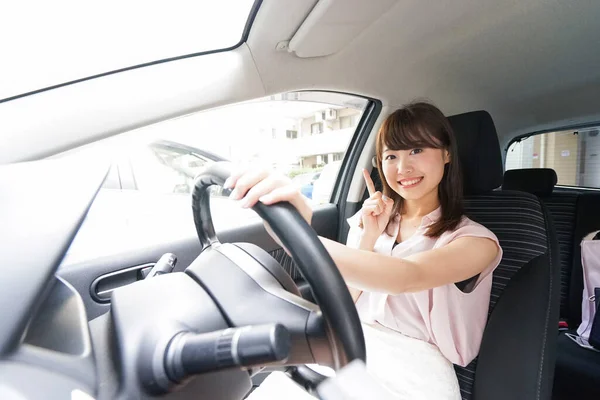 Young Asian Female Driver Pointing Something — Stock Photo, Image