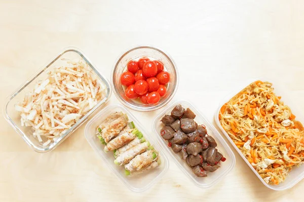 prepared meal in containers served on table